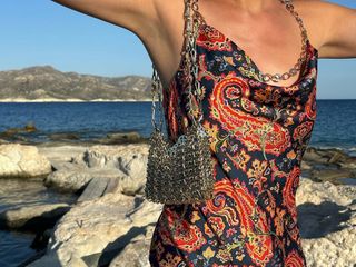 @helenacuesta wearing a Paco Rabanne chain mail dress and bag.