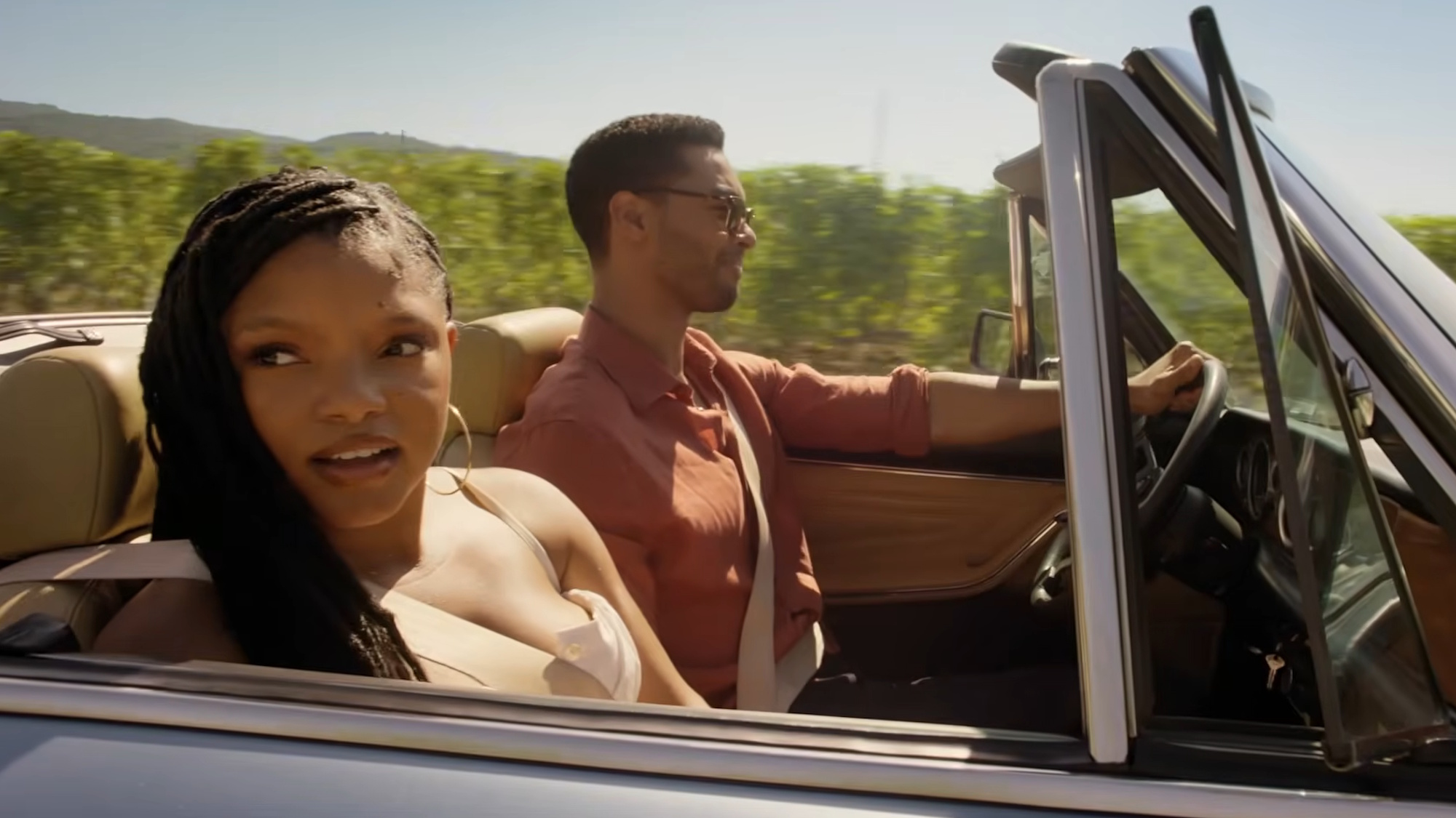 Halle Bailey and Rege-Jean Page are shown driving in You, Me &amp;amp; Tuscany.