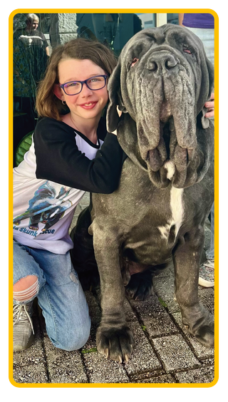 Image of girl, Delanie Dennis, with a big dog