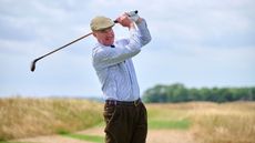 Fergus Bisset playing a golf shot