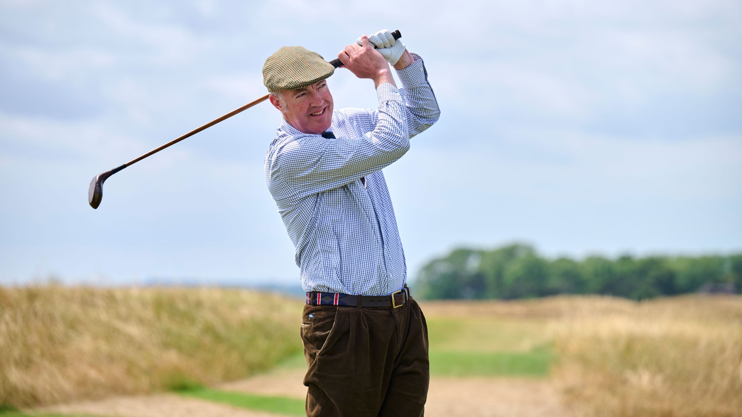 Fergus Bisset playing a golf shot