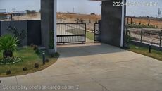 Screen-capture of a home security camera facing a front porch during an earthquake.