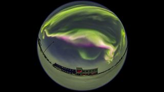 Northern lights through a fish-eye lens on Feb. 16, 2018, over the Churchill Northern Studies Centre, in Churchill, Manitoba. The image reveals a short-lived bright outburst when the bottom fringe of the auroral curtains turned brilliant pink, due to energetic electrons exciting lower-altitude nitrogen molecules.