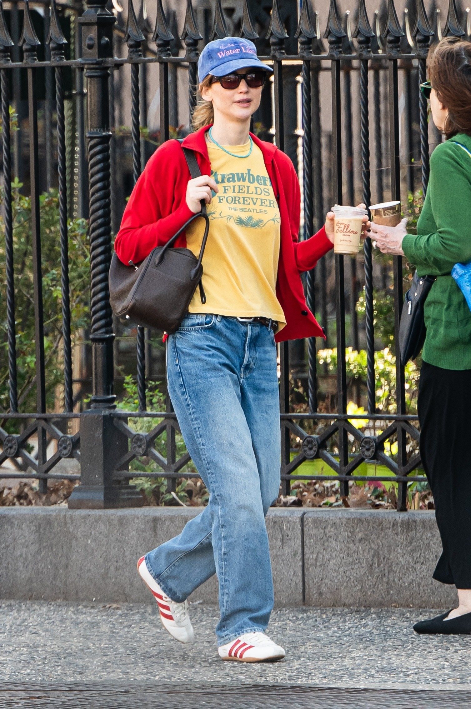 Jennifer Lawrence wore her jeans outfit with slim Adidas Tokyo sneakers on April 6