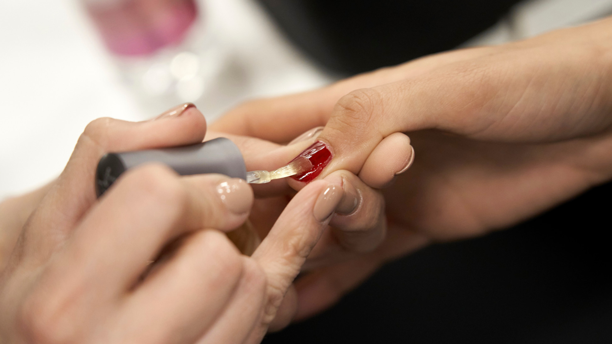 Close-up of well-groomed hands with healthy nails and hydrated cuticles