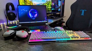 Image of an entire family of Alienware products on a desk.