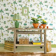 Green hallway with wooden console table