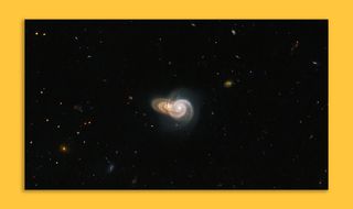 An image of two galaxies appearing to collide in space