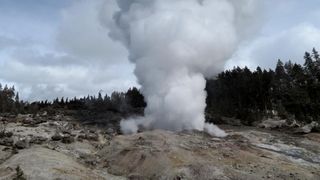 A USGS image shows steam rising from Steamboat Geyser after an earlier eruption.