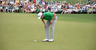 Webb Simpson inspecting things very closely