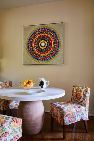 On the wall is an untitled 1968 work in acrylic and graphite on canvas by pioneering colour field painter Alma Thomas; on the table is a 2014 porcelain pitcher by Kara Walker. Courtesy the Eileen Harris Norton Collection