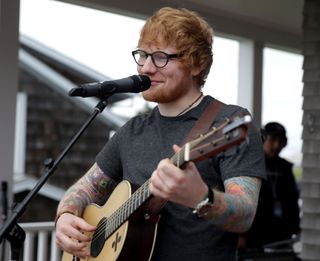 Ed Sheeran performing at Beech House with a guitar