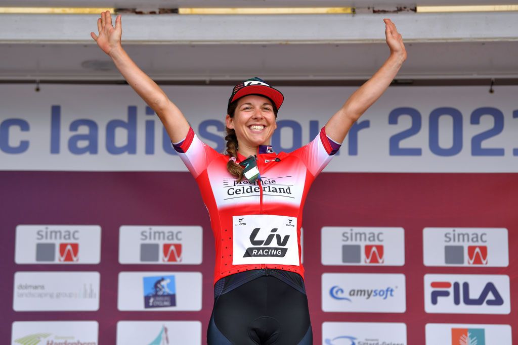 HARDENBERG NETHERLANDS AUGUST 25 Alison Jackson of Canada and Team Liv Racing celebrates winning the Red Most Combative Rider Jersey on the podium ceremony after the 23rd Simac Ladies Tour 2021 Stage 1 a 1344km stage from Zwolle to Hardenberg SLT2021 UCIWWT on August 25 2021 in Hardenberg Netherlands Photo by Luc ClaessenGetty Images