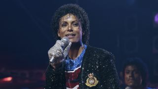 Jafaar Jackson as Michael Jackson with a sparkly outfit and a microphone in his hand