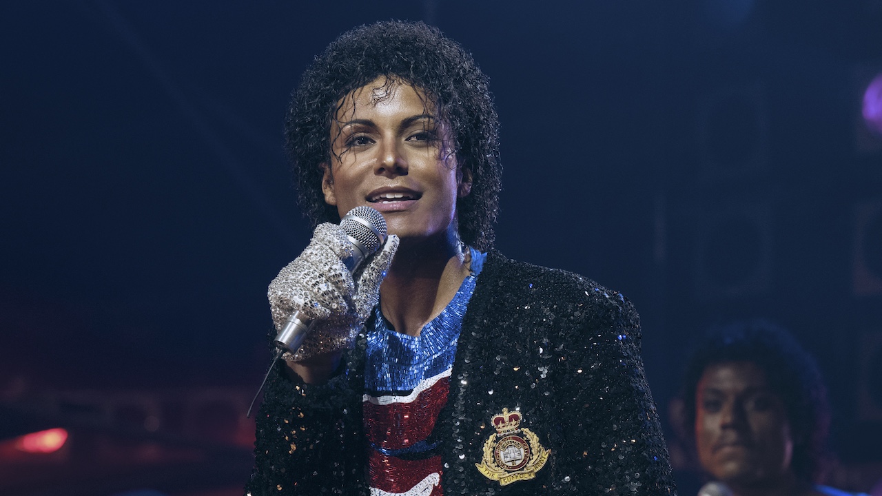 Jafaar Jackson as Michael Jackson with a sparkly outfit and a microphone in his hand