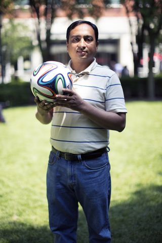 Nikhil Gupta, materials expert in the NYU-Polytechnic School of Engineering, with the Adidas Brazuca soccer ball.