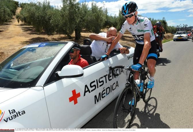 Chris Froome (Team Sky) goes back to the medical car