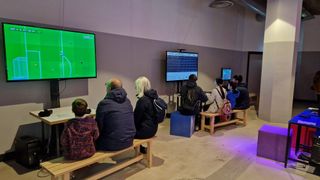 A picture of two groups of people playing games at the NVM