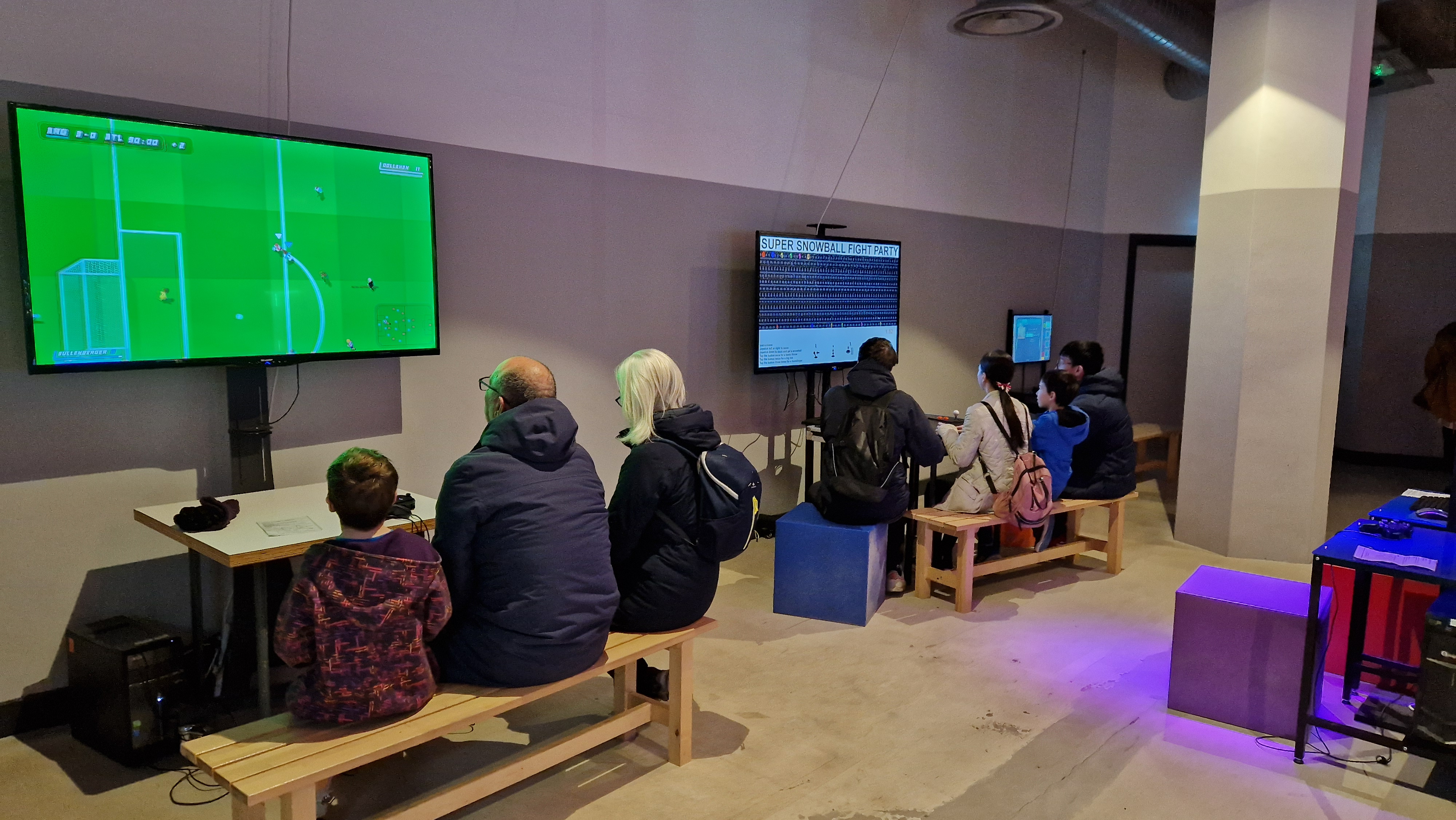 A picture of two groups of people playing games at the NVM