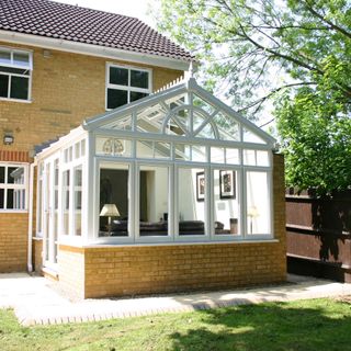 White frame conservatory with Victorian style roof