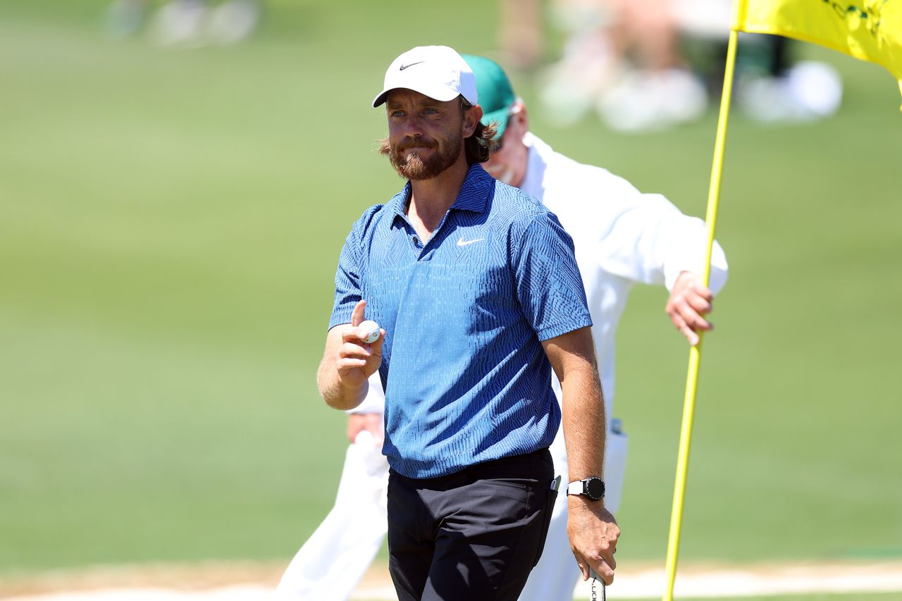 Tommy Fleetwood waves to the crowd at Augusta National