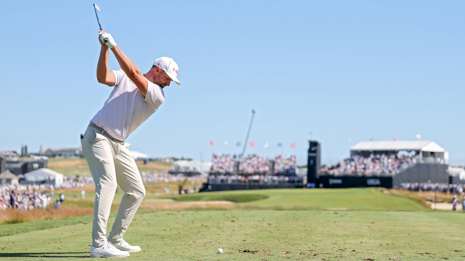 Wyndham Clark at the top of his backswing