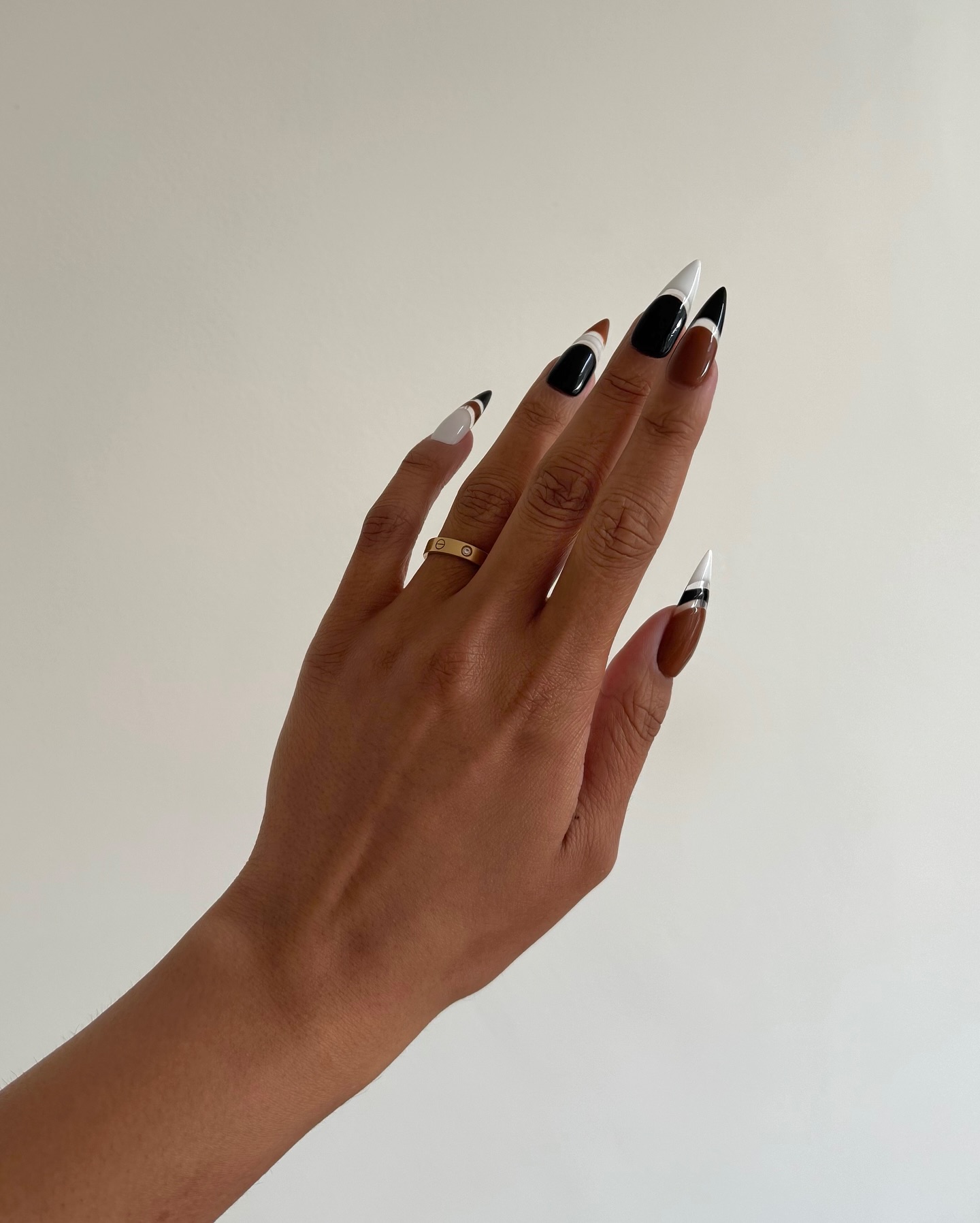 A neutral-toned sporty manicure by Iram Shelton