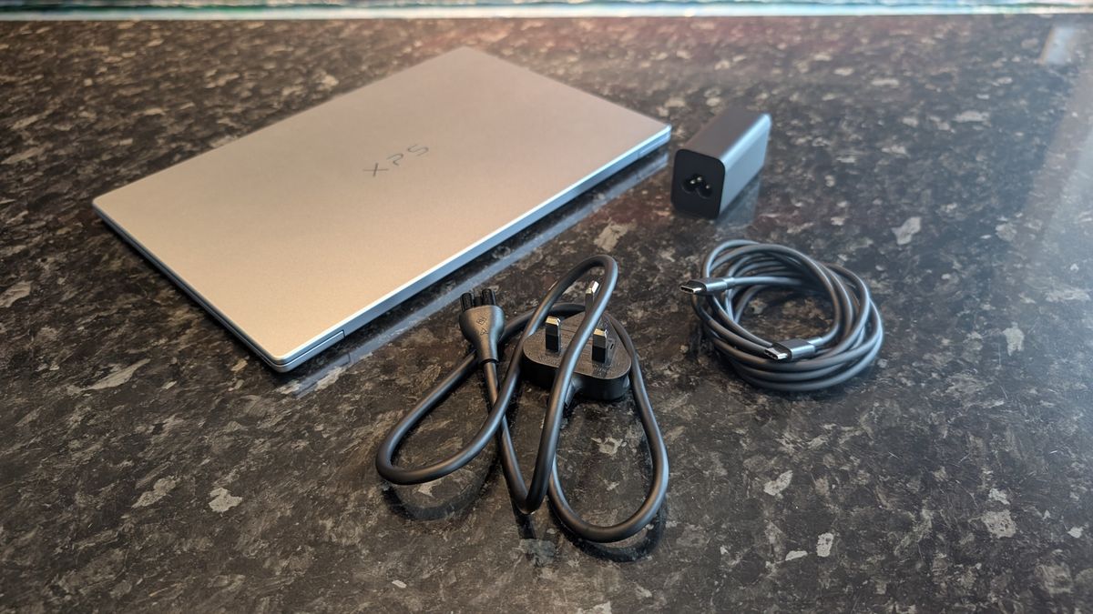 The Dell XPS 13 (2026) laptop pictured on a black marble worktop.