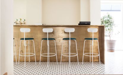 Wooden bar counter with barstools