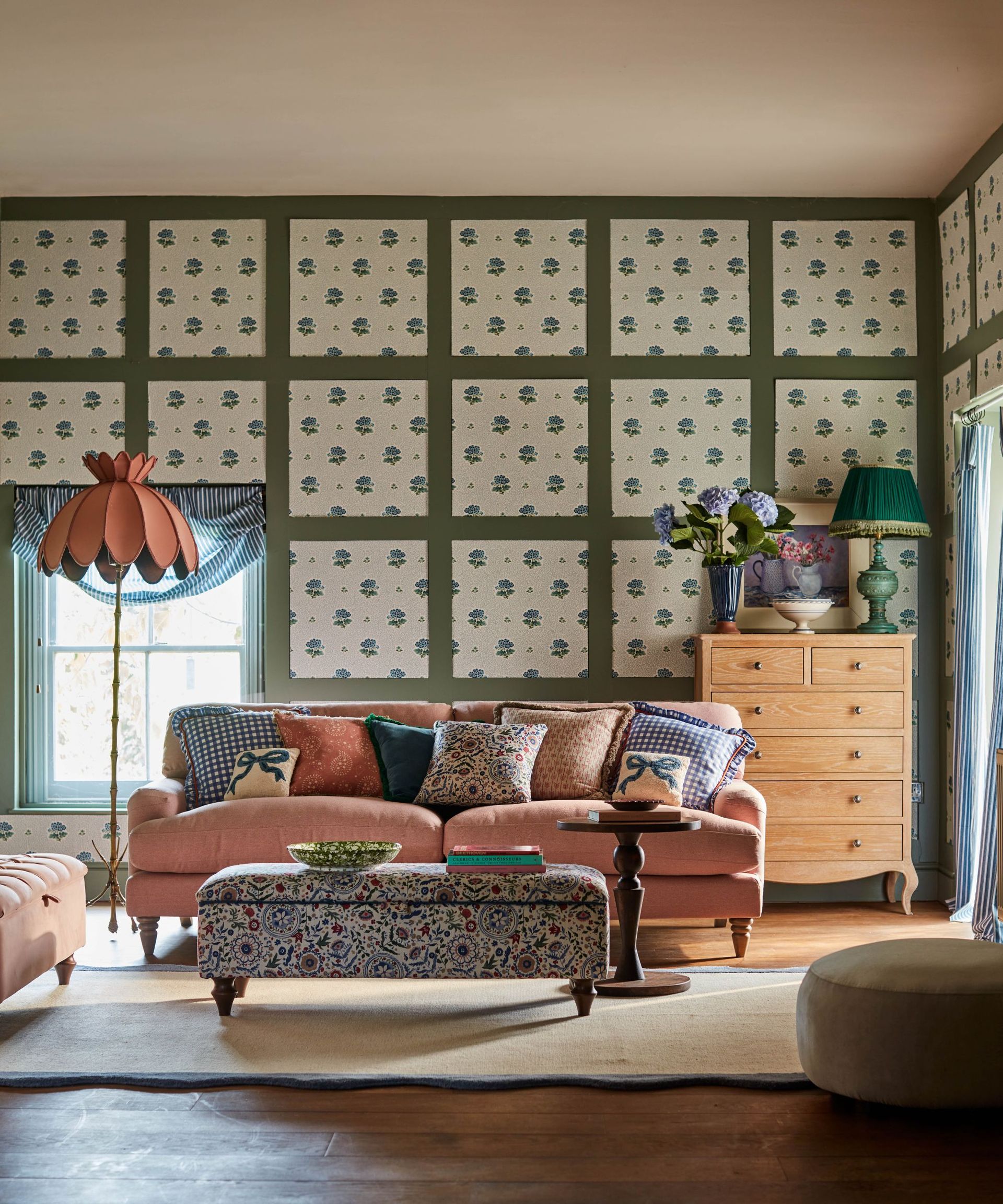 Pink sofa with vintage floral furnishings