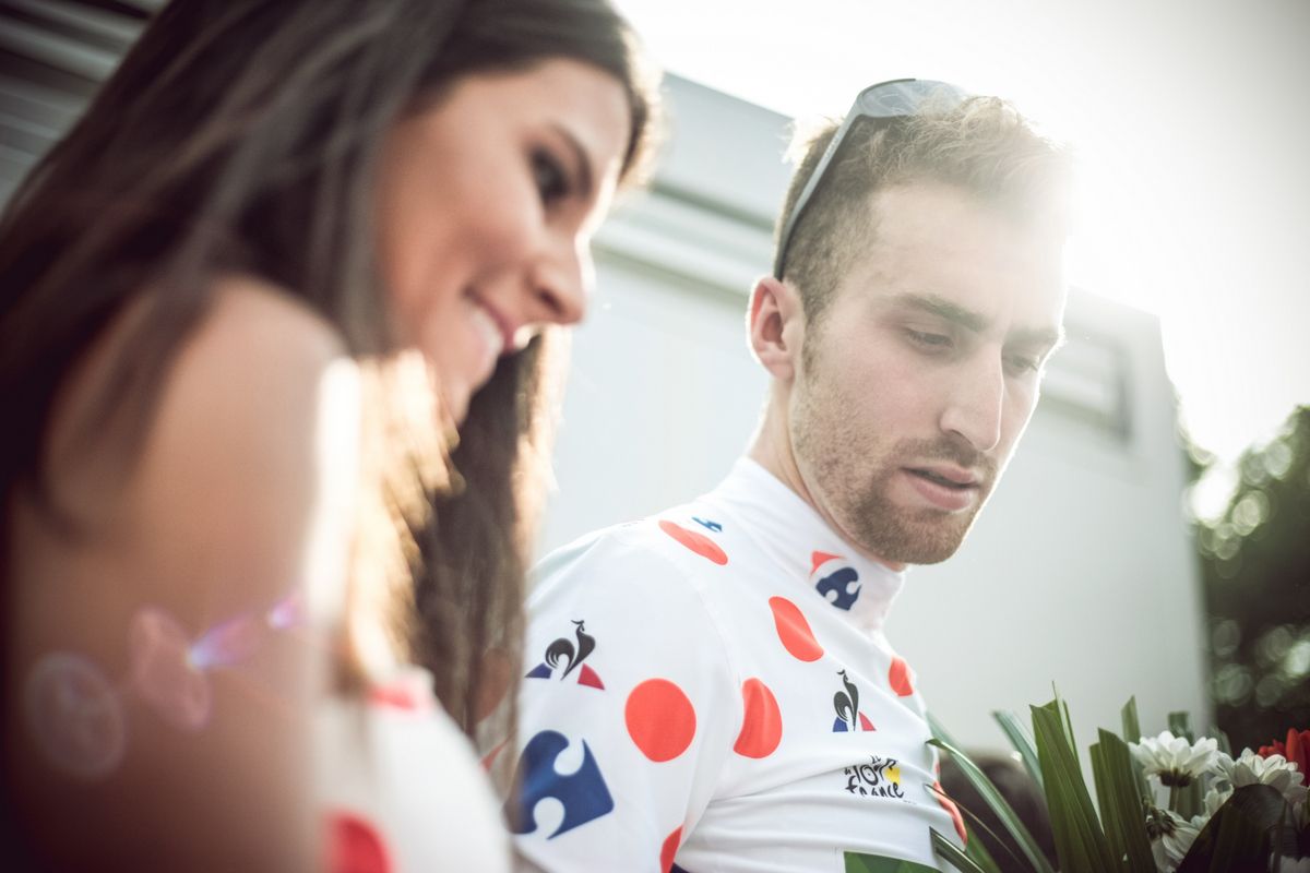 Taylor Phinney signing polka dots jerseys after his stage 2 breakaway