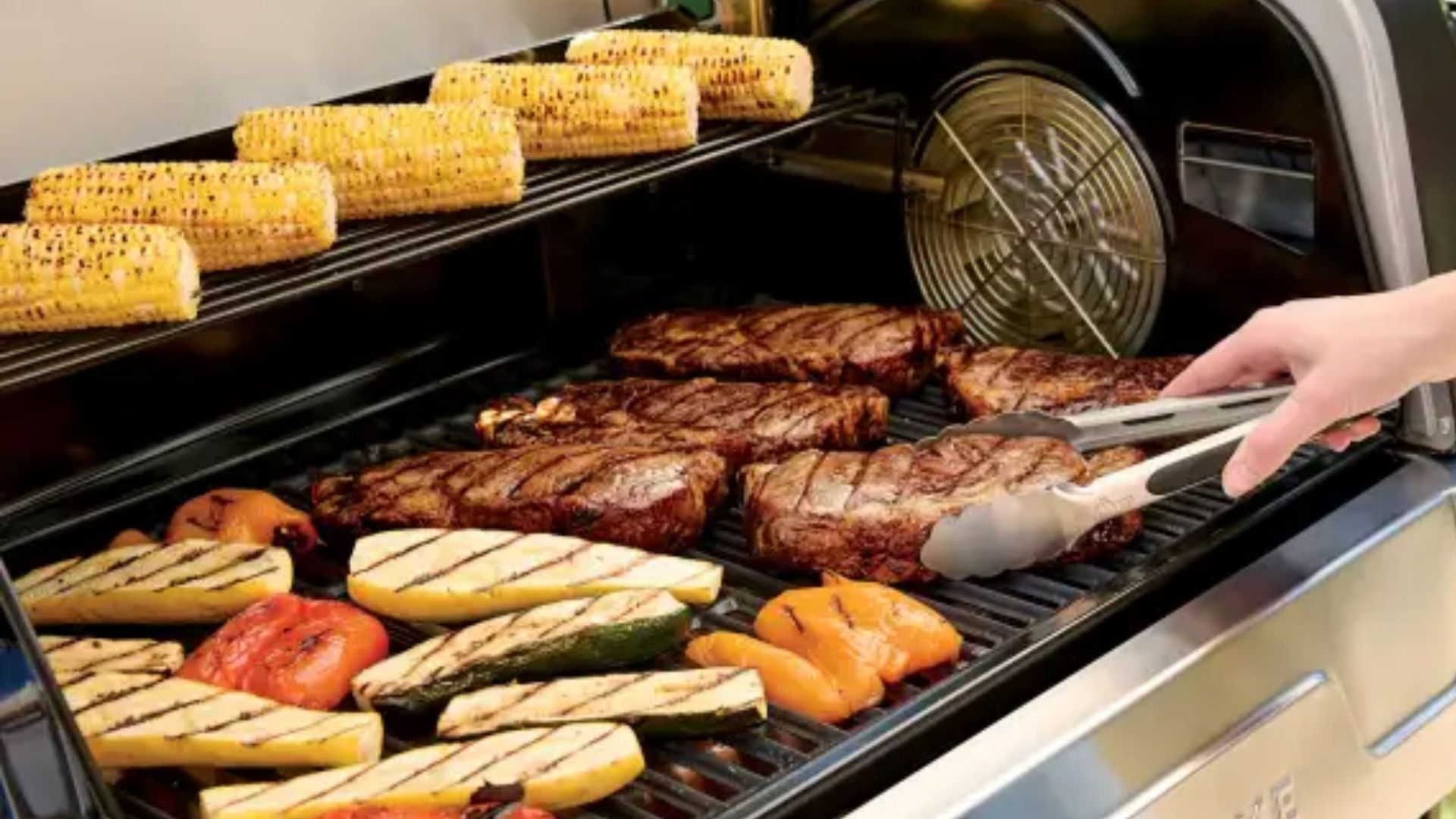 Ninja FlexFlame Gas BBQ and Outdoor Cooking System cooking vegetables and steaks