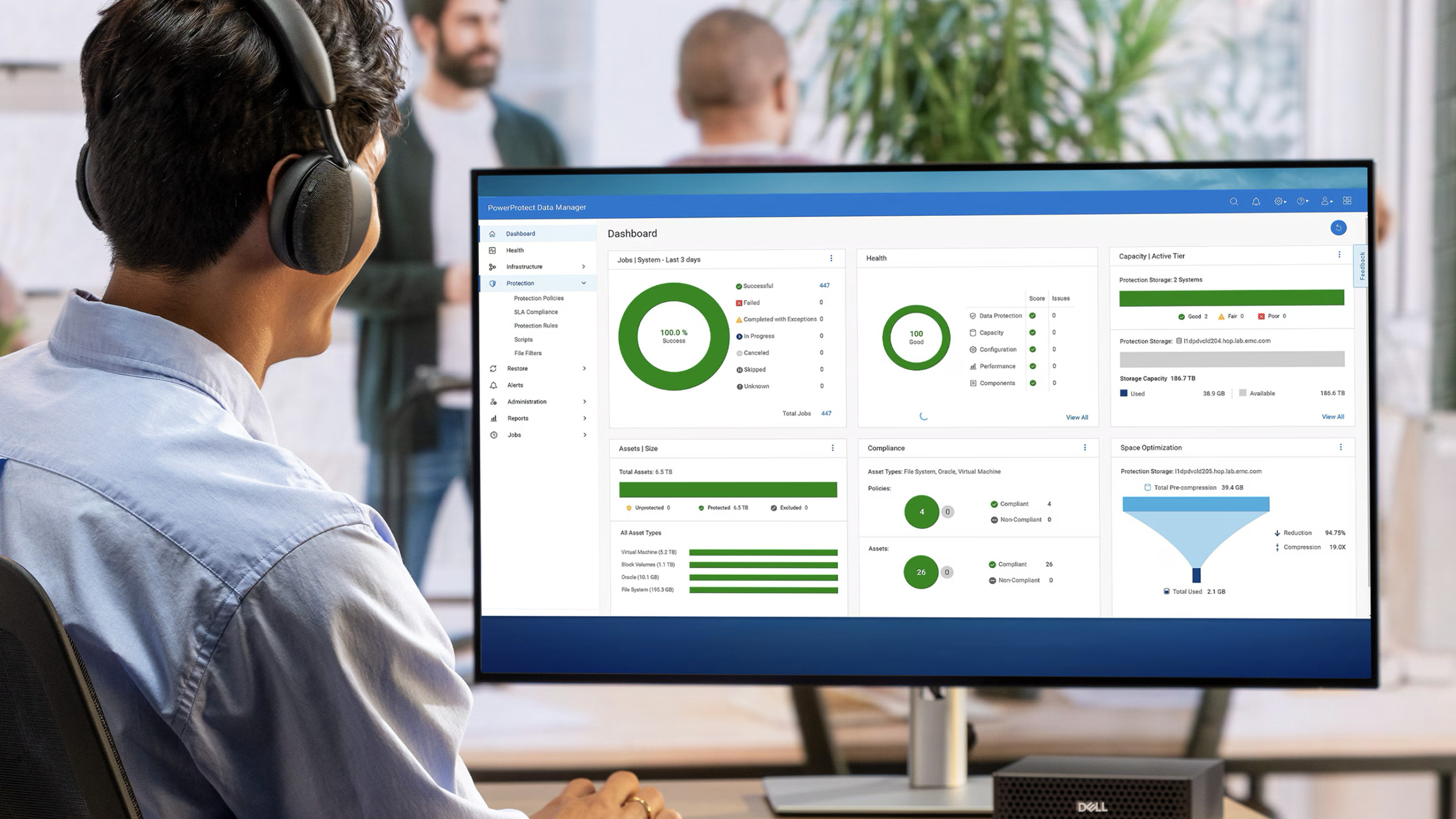 Person sat at a PC looking at PowerProtect Data Manager dashboard