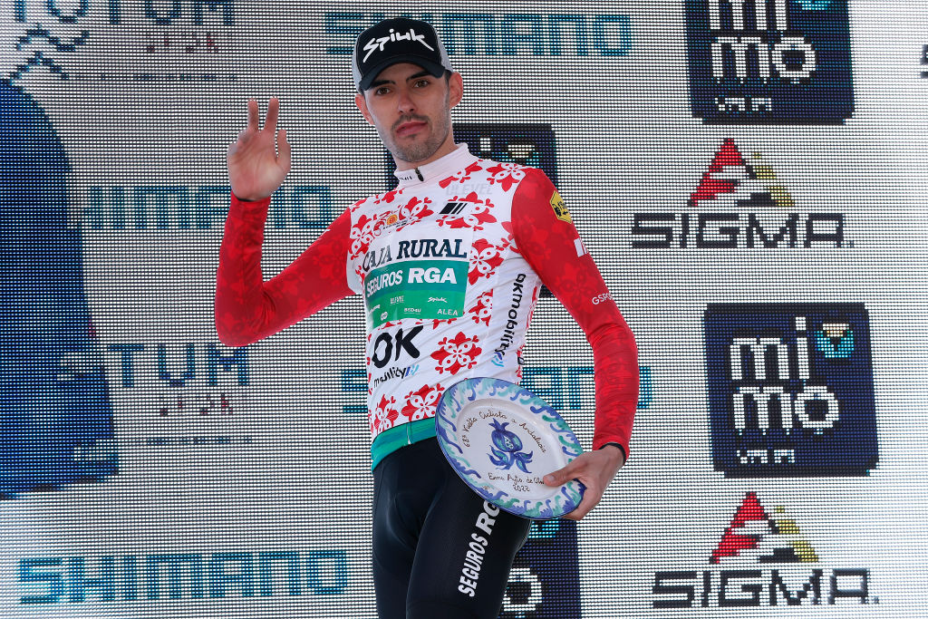 OTURA SPAIN FEBRUARY 18 Jon Barrenetxea Golzarri of Spain winning the red mountain jersey on the podium ceremony after the 68th Vuelta A Andalucia Ruta Del Sol 2022 Stage 3 a 1532km stage from Lucena to Otura 68RdS on February 18 2022 in Otura Spain Photo by Bas CzerwinskiGetty Images