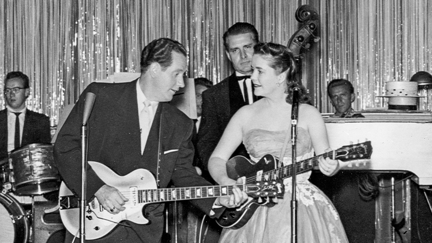 CAMDEN, NJ - SEPTEMBER 20: Husband and wife singer/songwriter duo Les Paul &amp;amp; Mary Ford perform onstage with Gibson Les Paul acoustic guitars and a full back up band at Chubby's &amp;quot;Home of the stars&amp;quot; on September 20, 1953 in Camden, New Jersey.