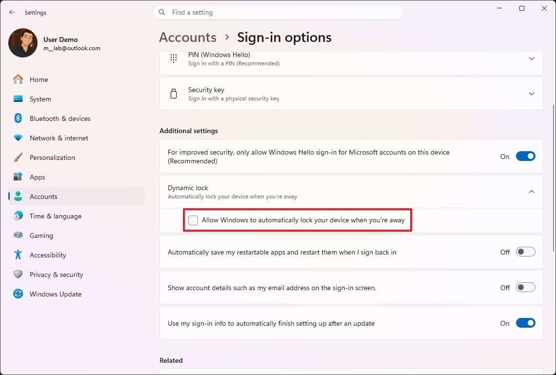 Windows 11 "Sign-in options" settings screen showing a user profile. The Dynamic lock option is highlighted, with a checkbox to allow automatic locking when away.