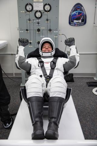 NASA astronaut Bob Behnken wears the SpaceX pressure suit that will protect him during launch on board the company's Crew Dragon spacecraft.