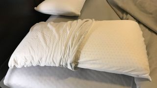The Brooklyn Bedding Talalay Latex Pillow with the cover pulled back