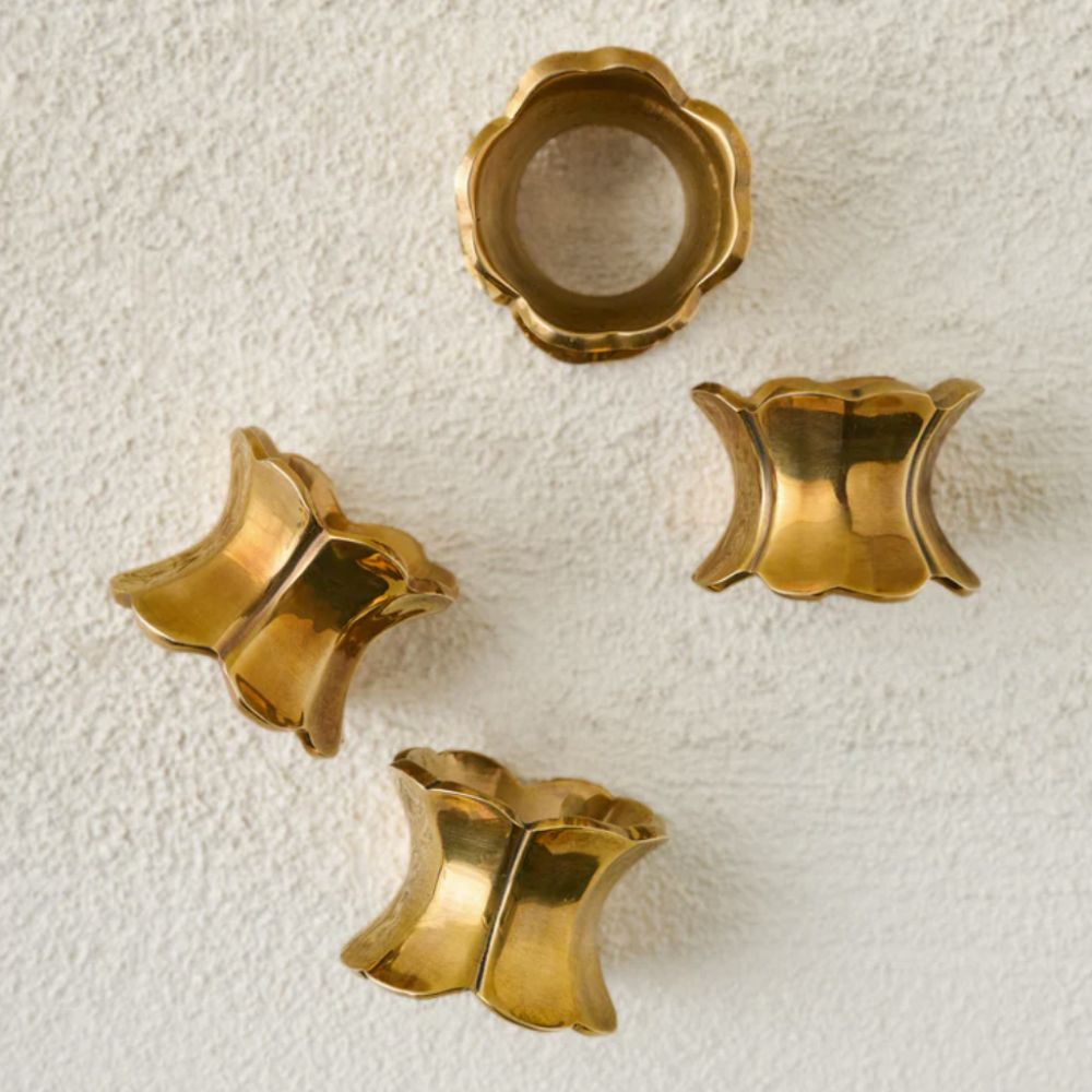 Four antiqued brass napkin rings