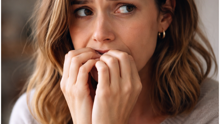 Woman nervously biting nails
