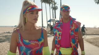 Barbie and Ken in their hot pink rollerblading outfits by the beach. They both look suspicious.