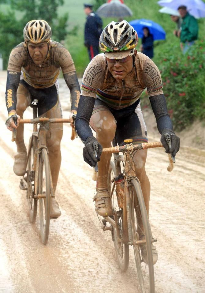A muddy Cadel Evans on the stage to Montalcino
