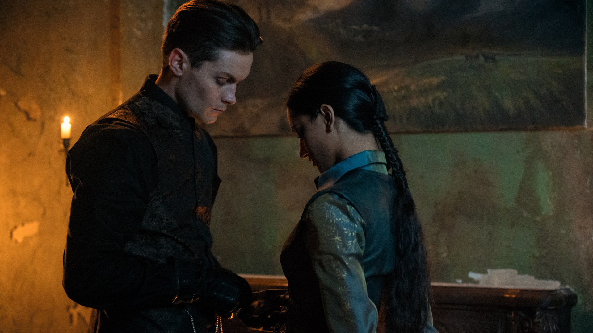 Kaz and Inej share a moment in a dimly lit room in Shadow and Bone season 2