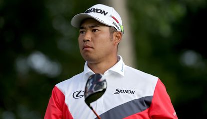 Matsuyama holds a pose after hitting a tee shot with a fairway wood