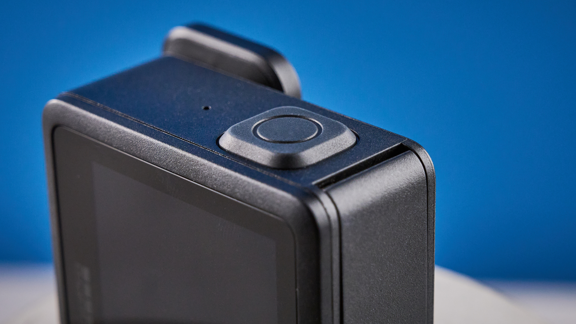 The GoPro LIT Hero against a blue background