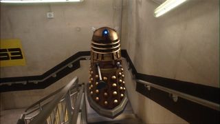A Dalek hovering up the stairs from the Doctor Who episode "Dalek"