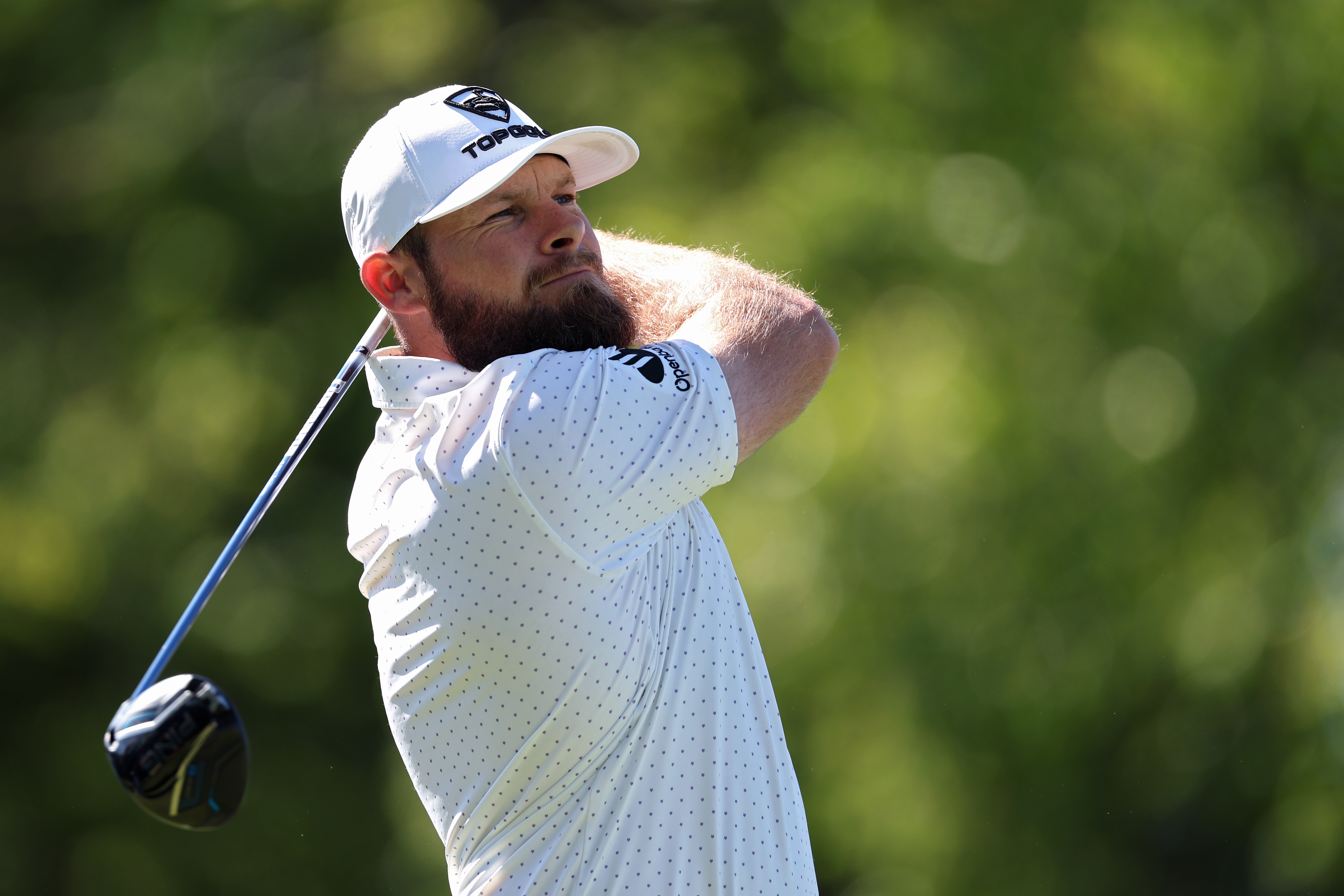 Tyrrell Hatton plays his shot from the second tee during a practice round prior to the PGA Championship at Aronimink Golf Club