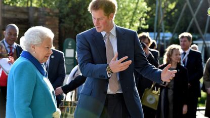 Queen Elizabeth II and Prince Harry attend at the annual Chelsea Flower show at Royal Hospital Chelsea on May 18, 2015 in London, England.