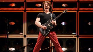 Eddie Van Halen of Van Halen performs at their dress rehearsal for family and friends at the Forum on February 8, 2012 in Inglewood, California.