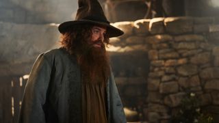 Tom Bombadil (Rory Kinnear) in his robe and pointy hat in "The Rings of Power" season 2